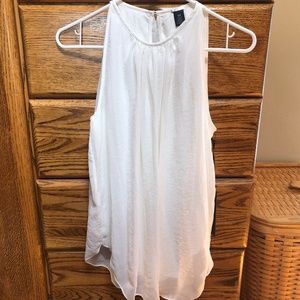 Off white sleeveless blouse